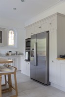 Grey shaker style kitchen with American style fridge freezer