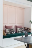 Nook seating with pink and green cushions