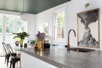 Modern kitchen diner with green and copper