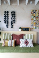 Modern textured cushions and colourful wall hangings