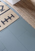 Tiled grey floor and sisal rugs - detail 