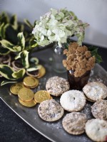 Christmas themed display of mince pies and plants