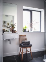 Bathroom featuring basin and dried flower arrangements