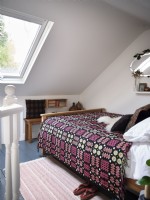 Scandinavian style bedroom with retro blanket