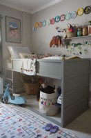 Childrens bed and toys displayed on shelf and stored under the bed. 
