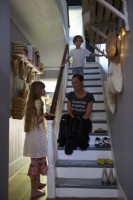 The owner and two of her children in the hallway.