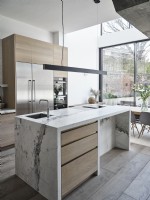 Modern island unit in open plan kitchen and dining room