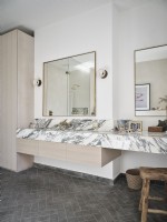 Minimalistic bathroom with marble sink and surfaces