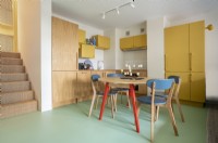 Built in kitchen area in Barbican Maisonette with dining table and chairs