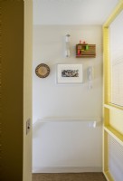 Yellow pastel hallway in Barbican apartment