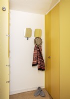 Yellow pastel hallway in Barbican apartment