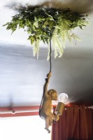 Novelty monkey pendant light with fake foliage on ceiling 