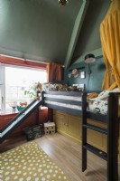 Bunk bed with slide in colourful childrens bedroom