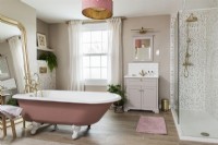 Vintage style feminine bathroom with rolltop bath