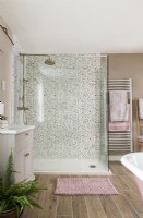 Patterned tiling in shower cubicle - feminine bathroom