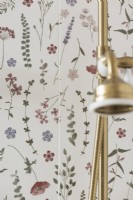 Floral wall and gold shower head in feminine bathroom - detail 