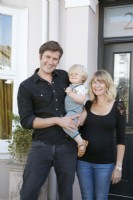 Home owner portrait Brighton Hove Victorian House, by front door. Mum Dad and baby boy
