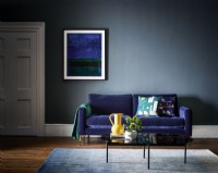 Blue sofa against blue wall