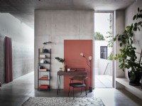 Contemporary desk and shelves in an industrial concrete setting
