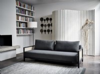 Grey sofa infront of curved feature screen