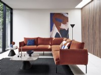 Contemporary orange corner sofa in modern room