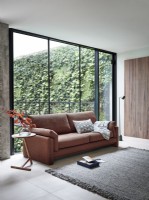 Sofa in front of windows in modern room