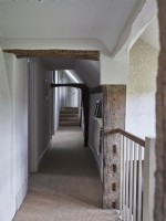 Corridor with exposed wooden beams 