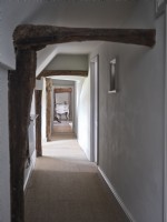 Hallway with exposed wooden beams