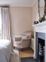 Pink bedroom with armchair