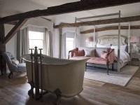Bedroom with a freestanding bath