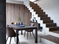 Dining room at bottom of contemporary open plan stairs