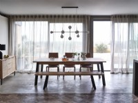 Dining table in front of windows