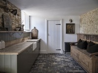 Retro kitchen area with exposed brickwork