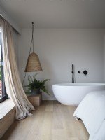Freestanding bath in bedroom