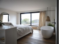 Bedroom with freestanding bath