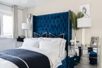 Modern bedroom with blue headboard