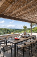 Outdoor dining area with scenic views in summer 