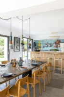 Modern kitchen-diner with colourful splashback wall