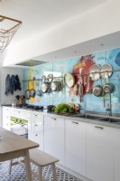 Modern kitchen with colourful splashback feature wall