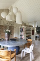 Eclectic furniture and fittings in country dining room
