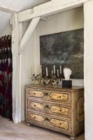 Antique chest of drawers and artwork 