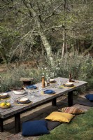 Rustic outdoor dining table laid for lunch