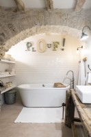 Freestanding bath in alcove of modern country bathroom