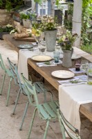 Rustic outdoor dining table laid for lunch