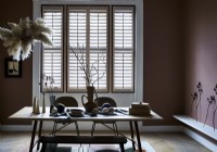 Dining table and ornaments with window shutters