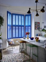 Marble kitchen island with blue shutters