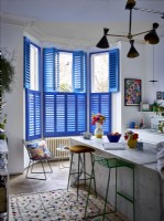 Marble kitchen island with blue shutters