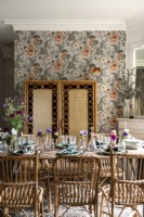 Bamboo screen and wicker furniture in retro style dining room