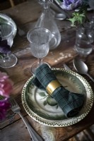 Gold napkin ring - detail of dining table 