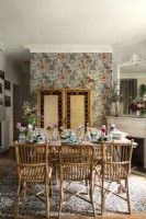 Bamboo screen and wicker chairs in retro style dining room